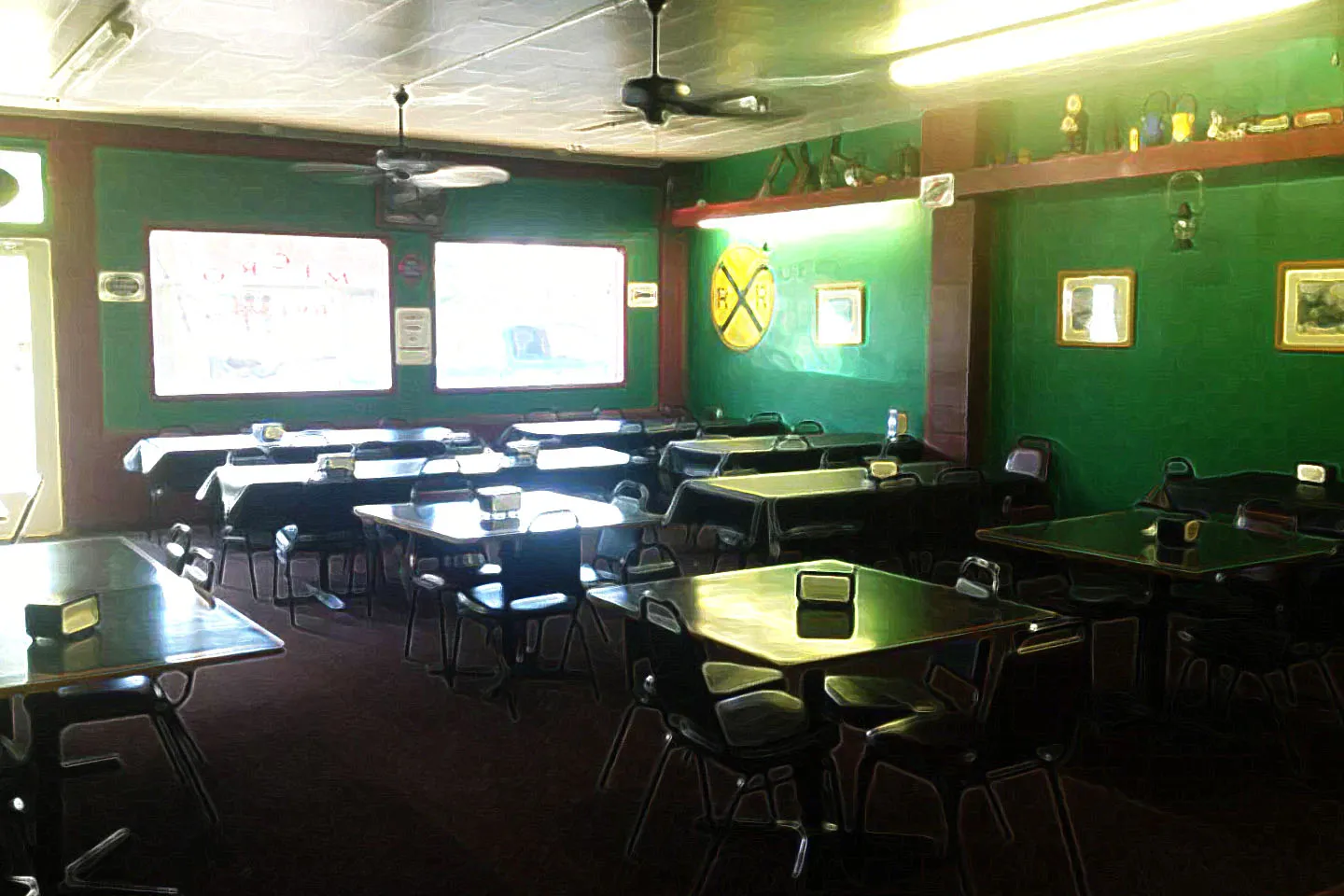 Green dining room with booths